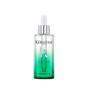 A bottle of Kérastase Paris Specifique Potentialiste serum with a dropper cap, featuring a gradient green design and silver accents, is shown on a plain white background. This elegant packaging showcases the innovative Specifique Potentialiste formula inside. | Blush Salon Collective - Fargo, ND