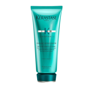 A turquoise tube of Kérastase Resistance Fondant Extentioniste hair conditioner stands upright against a plain white background, showcasing the signature styling of the Resistance Fondant Extentioniste range. | Blush Salon Collective - Fargo, ND