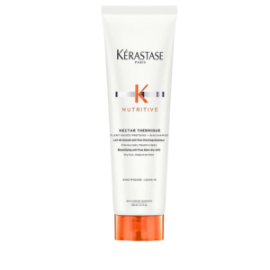 A white tube of Kérastase Nutritive Nectar Thermique hair care, 150ml, with orange accents and product information printed on the front. | Blush Salon Collective - Fargo, ND