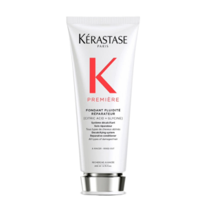 A tube of Kérastase Première Fondant Fluidité Réparateur conditioner with citric acid and glycine, shown upright against a white background, highlighting the luxurious Premiere care and restorative benefits of the Fondant formula. | Blush Salon Collective - Fargo, ND