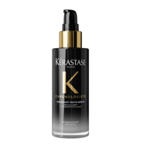 A black and gold pump bottle of Kérastase Chronologiste Overnight Youth Serum, labeled with product details in white and gold text, is displayed on a plain white background. | Blush Salon Collective - Fargo, ND