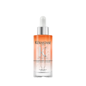 A bottle of Kérastase Nutritive Scalp Serum with a dropper cap, containing orange and clear liquid, shown against a white background—perfect for elevating your hair care routine. | Blush Salon Collective - Fargo, ND