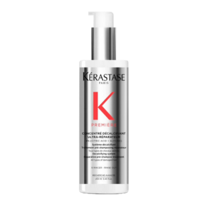 Kérastase Première Concentre Decalcifiant hair treatment bottle with pump dispenser features a sleek silver and white design, accented by the signature red “K” logo and black text on the front for an ultra-réparateur touch. | Blush Salon Collective - Fargo, ND