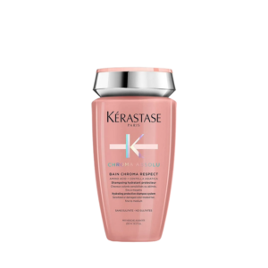 A pink bottle of Kérastase Chroma Absolu Bain Chroma Respect shampoo with silver accents, shown against a white background, highlights luxurious hair care for vibrant, healthy-looking hair. | Blush Salon Collective - Fargo, ND