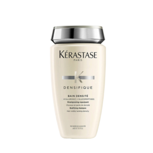 A bottle of Kérastase Paris Densifique Bain Densité shampoo, designed to boost hair density, with a silver cap, shown against a plain white background. | Blush Salon Collective - Fargo, ND