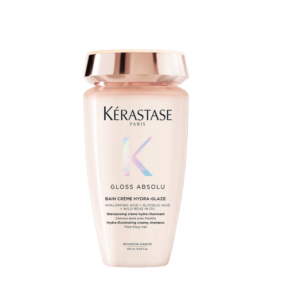 A bottle of Kérastase Paris Bain Creme Gloss Absolu Hydra-Glaze shampoo for thick, frizzy hair, with hyaluronic acid and glycolic acid, shown against a white background. | Blush Salon Collective - Fargo, ND