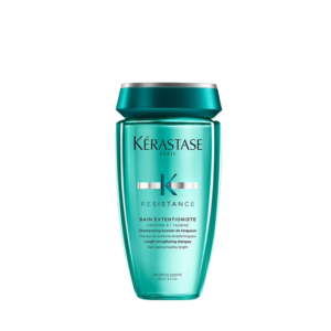 A teal bottle of Kérastase Resistance Bain Extentioniste shampoo, known for its hair strengthening and hair growth benefits, is shown on a plain white background. | Blush Salon Collective - Fargo, ND