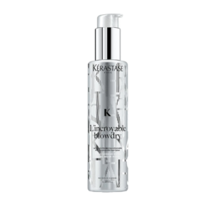 Clear bottle of Kérastase L’incroyable Blowdry, a heat styling lotion with a silver pump designed for effortless styling, showcased against a plain white background. | Blush Salon Collective - Fargo, ND