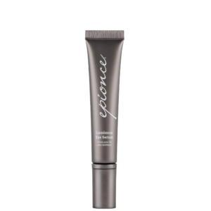 A tube of Luminous Eye Serum with a metallic finish and white text, standing upright against a white background. | Blush Salon Collective - Fargo, ND
