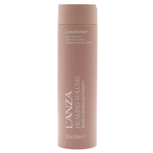 A tan bottle of L’ANZA Healing Volume Conditioner with bamboo bodifying complex, 8.5 fl oz (250 ml), stands upright against a white background, showcasing the restorative power of the Healing Volume Conditioner. | Blush Salon Collective - Fargo, ND