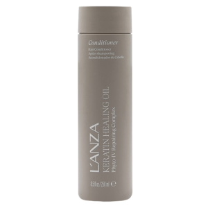 A taupe bottle of L’ANZA Keratin Healing Conditioner, 8.5 fl oz, with white text and a flip-top cap, shown against a plain white background. | Blush Salon Collective - Fargo, ND