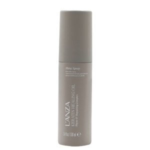 A tan bottle of L’ANZA Keratin Healing Oil Shine Spray, 100 ml, standing upright against a white background. | Blush Salon Collective - Fargo, ND