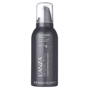 A bottle of L’ANZA Healing Style Foundation Mousse with a clear plastic cap, shown against a plain white background. This lightweight mousse delivers exceptional foundation and hold for beautifully styled hair. | Blush Salon Collective - Fargo, ND