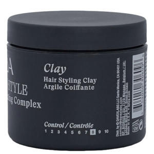 A black plastic jar labeled “Clay Hair Styling Clay” with product details and a control scale from 8 to 10 on the front. | Blush Salon Collective - Fargo, ND