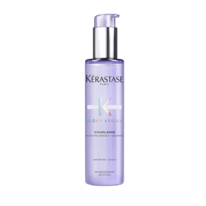 A bottle of Kérastase Paris Blond Absolu Cicaplasme hair treatment with a lavender pump dispenser, shown against a plain white background. This nourishing leave-in serum from the Blond Absolu range acts as a Thermique protector, helping to shield blonde hair from heat styling while strengthening and smoothing each strand. | Blush Salon Collective - Fargo, ND