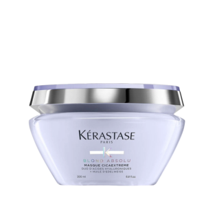 A jar of Kérastase Blond Absolu Masque Cicaextreme hair mask, designed specifically for blond hair care, features a silver and lavender lid and is shown against a plain white background. | Blush Salon Collective - Fargo, ND