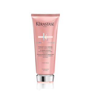 A pink tube of Kérastase Paris Chroma Absolu Fondant Cica Chroma conditioner, 200 ml, stands upright against a white background, highlighting a luxurious hair care essential from the Chroma Absolu collection. | Blush Salon Collective - Fargo, ND