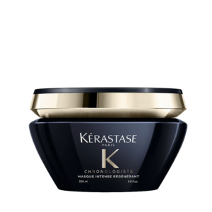 The Kérastase Chronologiste Masque Intense Régénérant hair mask comes in a sophisticated 200 ml jar, featuring a sleek black base and an elegant gold-trimmed lid, proudly labeled as “Masque Intense Régénérant.”. | Blush Salon Collective - Fargo, ND