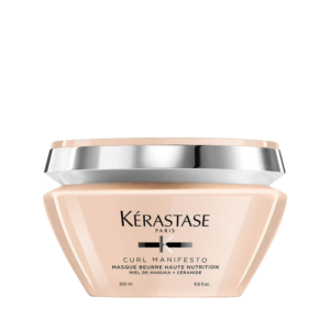 A 200ml jar of Kérastase Paris Curl Manifesto Masque Beurre Haute Nutrition, infused with manuka honey and ceramide, is shown against a plain background. | Blush Salon Collective - Fargo, ND