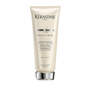 A beige tube of Kérastase Densifique Fondant Densité hair conditioner, designed to boost hair density, with black text and a silver cap, shown against a plain white background. | Blush Salon Collective - Fargo, ND